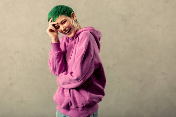 istock Joyful happy woman wearing a pink sweatshirt 1130746563