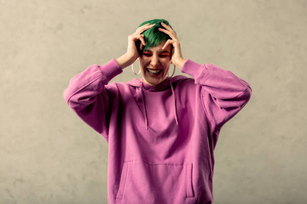 istock Delighted good looking woman touching her head 1130746567