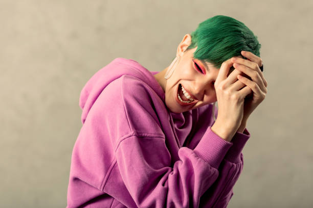 istock Delighted green haired woman feeling very optimistic 1130746575