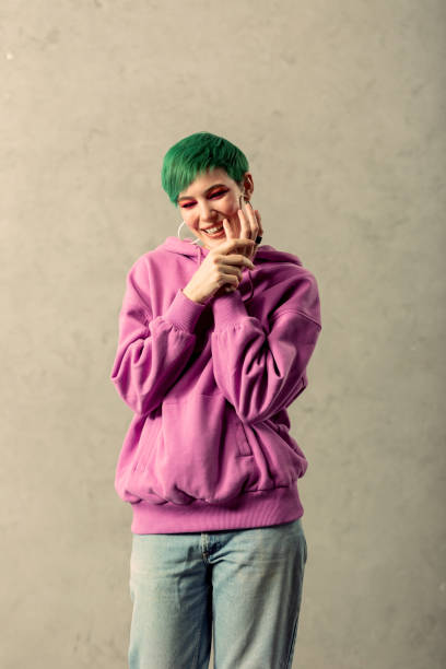 istock Positive nice joyful woman touching her hands 1130746580