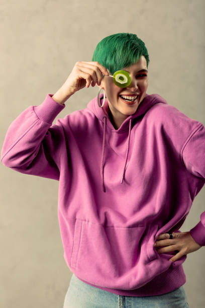 istock Cheerful good looking woman playing with a lollipop 1130746583
