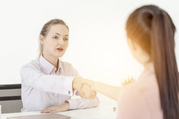 istock Woman business handshake congratulate co worker for success job interview 1130747314