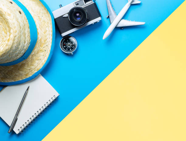 istock Summer Travel accessories on blue and Yellow background copy space 1130747450