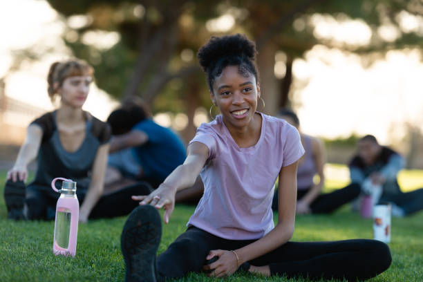 istock Stretching in the park with friends 1130747584