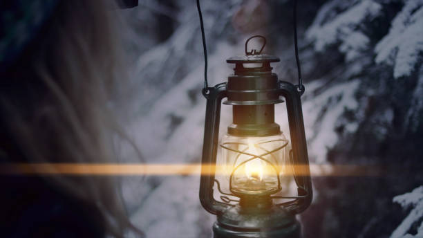 istock Walking in forest with lantern. Winter wonderland 1130748088