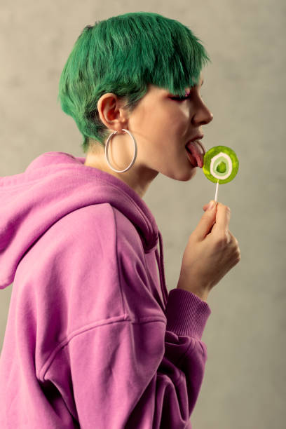 istock Nice pretty young woman having a lollipop 1130748308