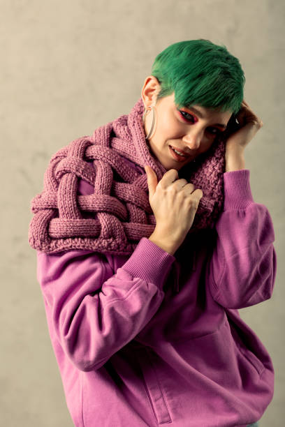istock Good looking attractive woman having a pink scarf 1130748317