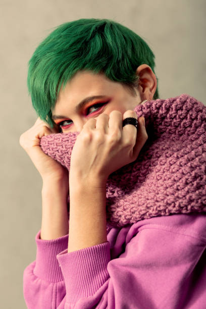 istock Nice attractive woman holding her pink scarf 1130748321