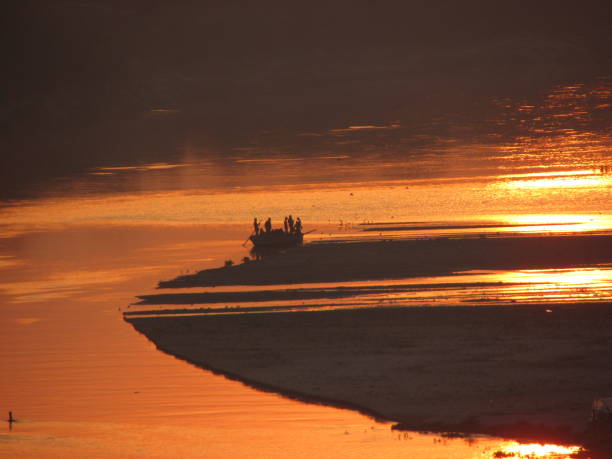 istock boat in the river at sunset time, beautiful scenic view, India 1130749062