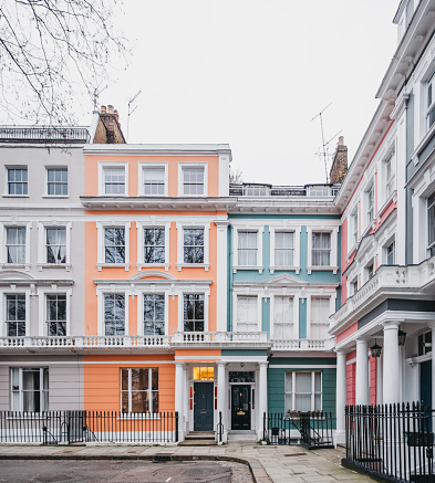 Pastel coloured terraced Victorian houses in London, UK.