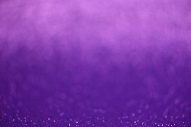 istock Purple glitter lights background. Defocused 1130749285