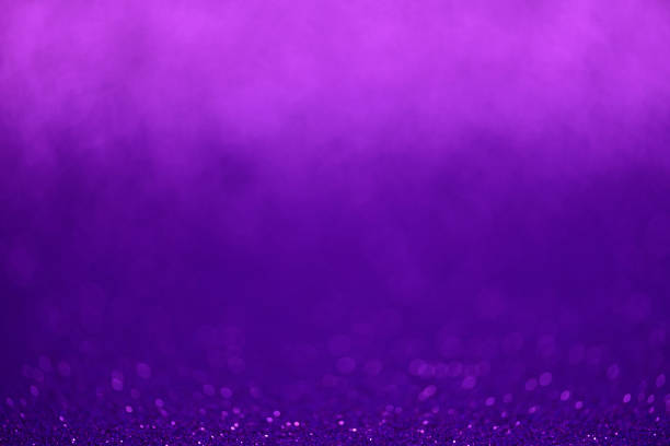 istock Purple glitter lights background. Defocused 1130749288