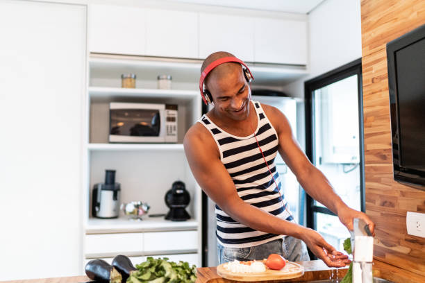istock Afro latin man cooking at home 1130749626