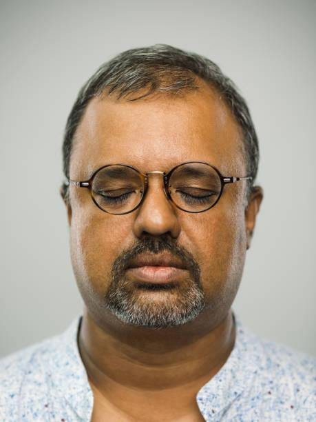 istock Real indian man with blank expression and closed eyes 1130749725