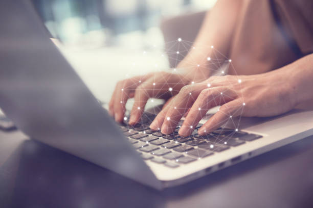 istock Woman hand using laptop device at co-working office, Social network concept. 1130753403