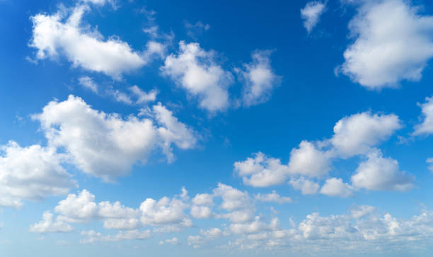 istock Clear blue sky with white fluffy clouds. Nature background 1130753411