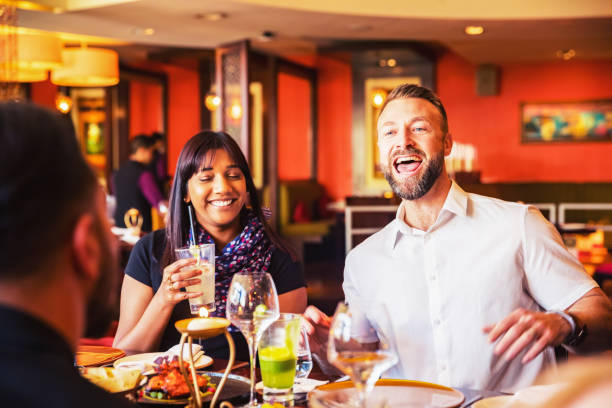 istock Boisterous friend talking aloud in a restaurant. 1130753593