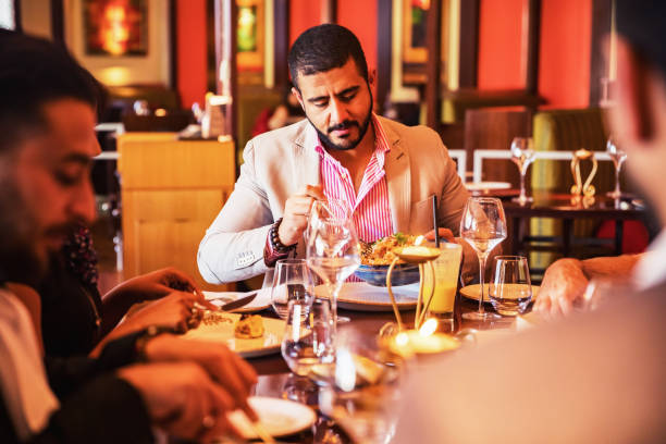 istock Middle Eastern Friends Enjoying a Meal at a Fine Dining Restaurant 1130754545