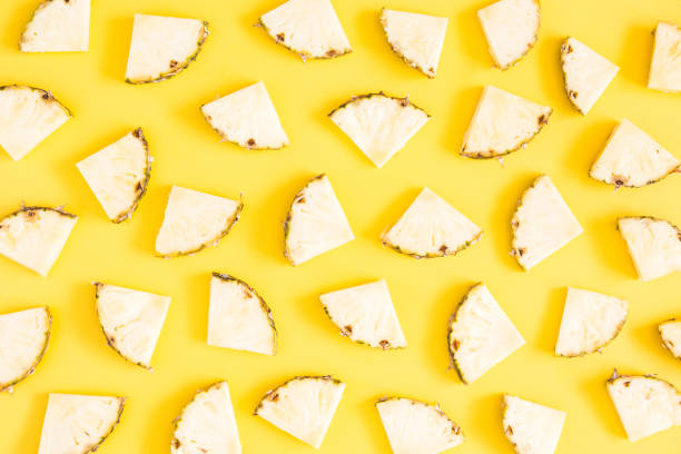 Pineapple on yellow background. Summer concept. Flat lay, top view