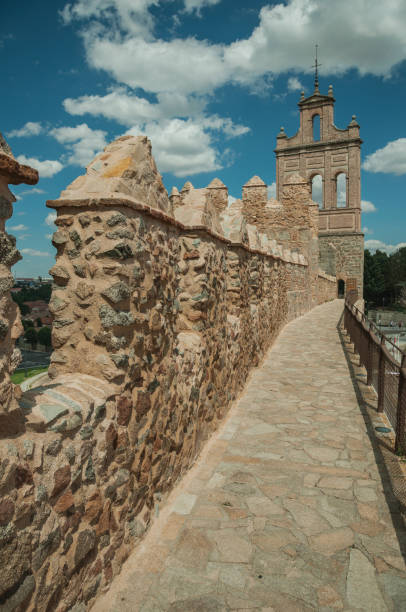 istock Pathway over old thick wall encircling the town of Avila 1130756033