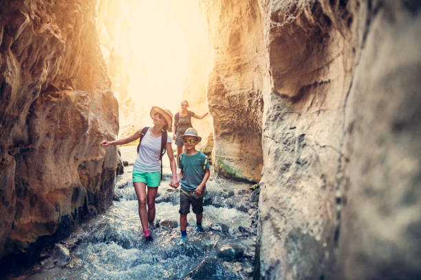 istock Family hiking through river in Andalusia, Spain 1130757253