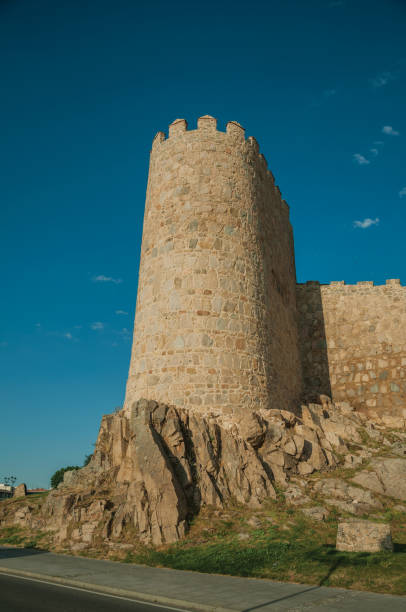 istock Stone tower over rocky terrain in the wall around Avila 1130757508