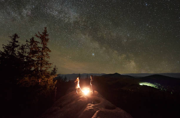 istock Night summer camping in the mountains under night starry sky 1130760265
