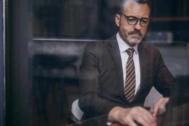 istock Senior businessman with eyeglasses 1130760271