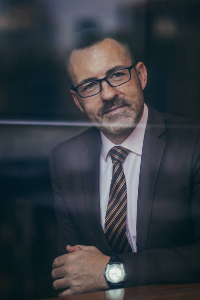 istock Happy senior man in a suit 1130760978