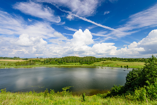 Traditional Russian nature in summer. Picturesque lake Gorodischenskoe, Old Izborsk, Pskov, Russia.