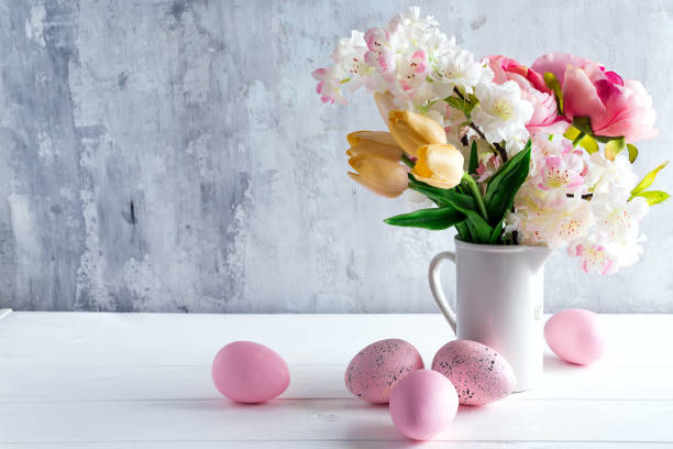 istock Easter greeting card backdrop with colorful spring flowers on white background. With copy space 1130763499