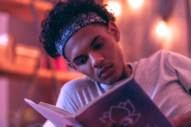 istock Meditative teen reading the methodological materials for the science project. 1130763881