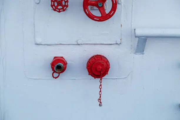 Fire fighting equipment, water hose, connections and valves for water ready for use at the bulkhead or wall on board a vessel