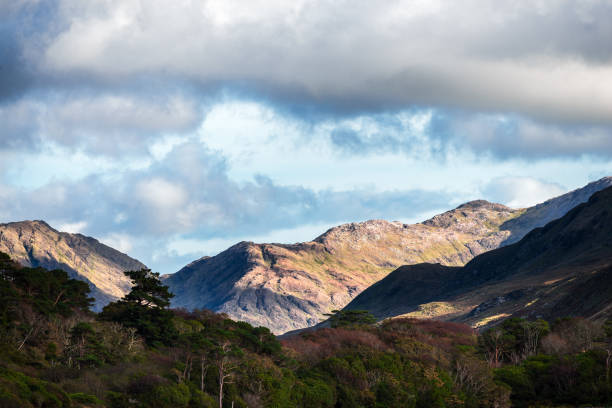 Mountains and stormy sky in Connemara Mountains and stormy sky in Connemara, County Galway, Ireland connemara national park stock pictures, royalty-free photos & images