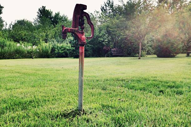 istock A red water spigot in a yard in the afternoon 1130768503