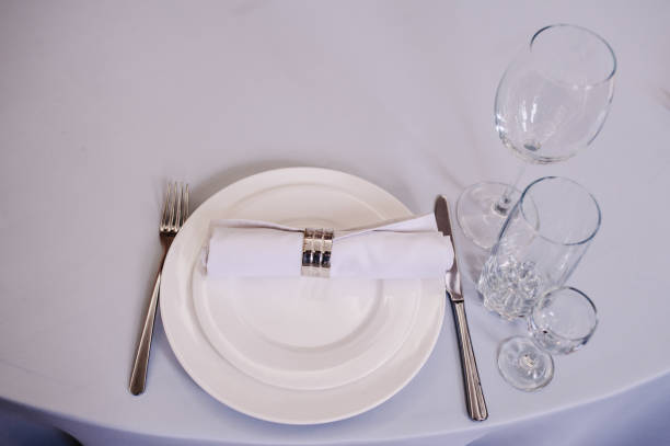istock Serving, setting table. Plate and silverware cutlery linen white napkin. Wedding table decoration. Artwork. top view. Close up. 1130768850