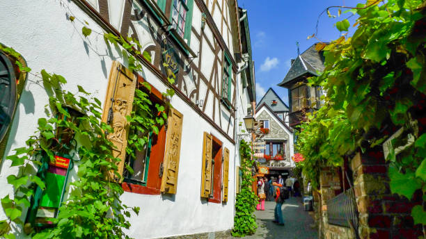 Rudesheim, Germany - September 2, 2014: Tourists are enjoying the street View at Rudesheim, Germany. The outside wall of building with local cultural decor.