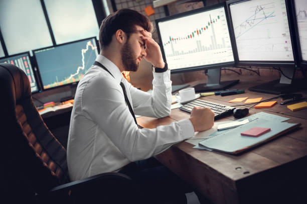 istock Young male trader at office work concept sitting disappointed 1130771092