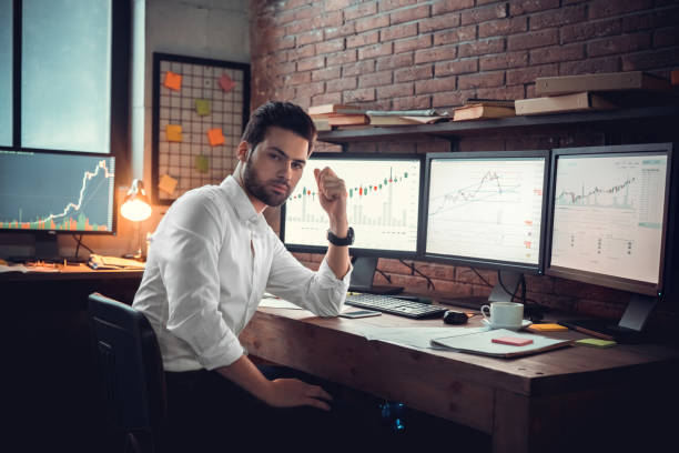 istock Young male trader at office work concept sitting smiling sleepy 1130771109