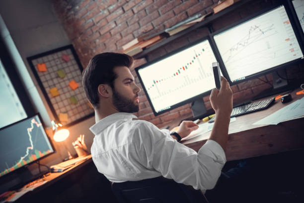 istock Businessman looking at screen his mobile phone 1130771176