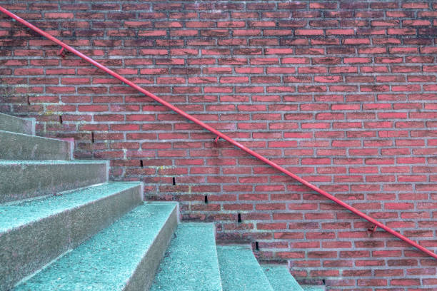 istock Brick wall with handrail and stairs 1130771402