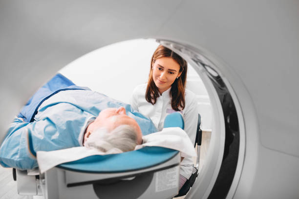 istock friendly doctor preparing elderly patient for CT Scan in hospital 1130772535