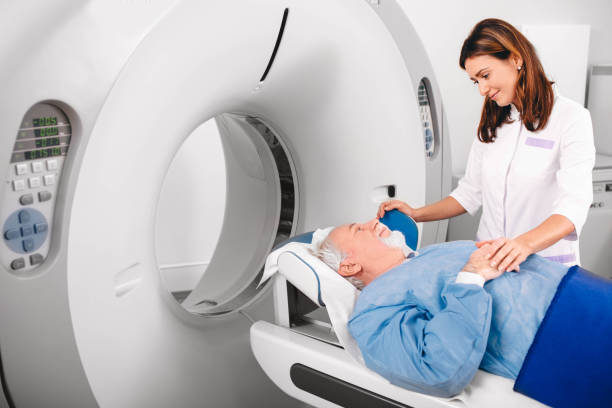 istock friendly nurse preparing elderly patient for CT Scan in hospital 1130772537