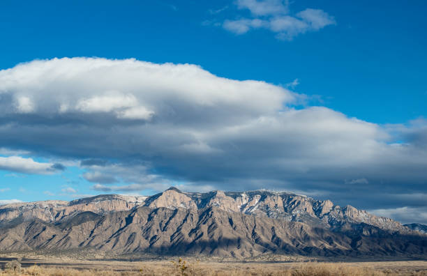 istock Majestic Cloudscape over Sandia Mountains in New Mexico 1130777196