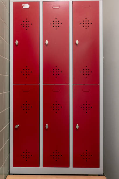 istock Changing lockers with red doors 1130777832