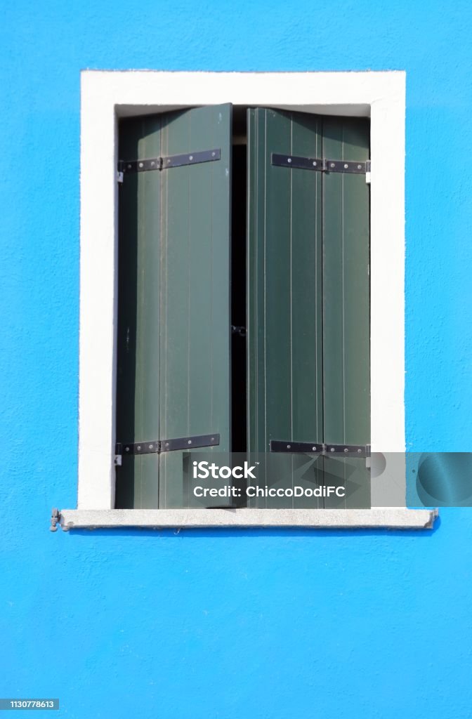 Window Rectangular Shut Rectangular Window With Closed Shutters And Light Blue Wall Stock Photo ...