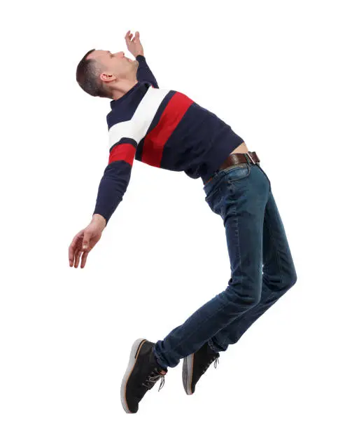 Photo of Side view of man in zero gravity or a fall.