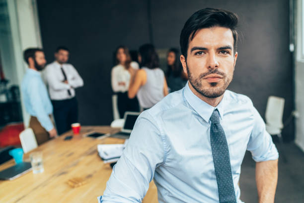 istock Businessman with his team behind 1130780786