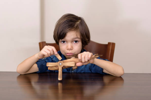 sadness little boy sadness little boy broken toy stock pictures, royalty-free photos & images