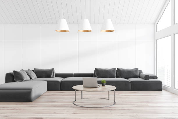 istock White attic living room with sofa 1130782475